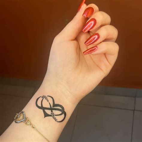 heart and infinity tattoo|infinity symbol with two hearts.